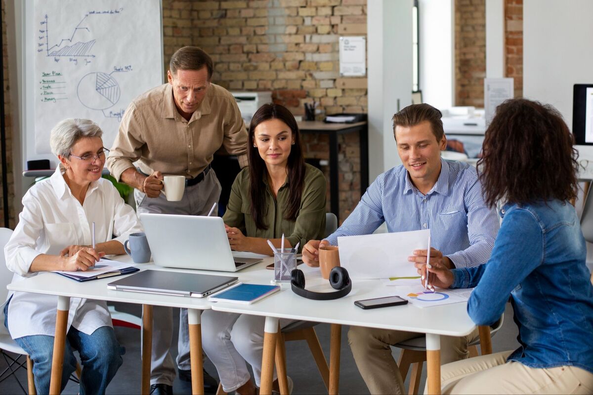 A team of educators planning together around a table